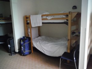 HI-Chicago dorms featured the best of both worlds: partial walls around the beds for more privacy, but tall bunks, high ceilings, and an extra foot of room between the bed and wall to accommodate tall people.